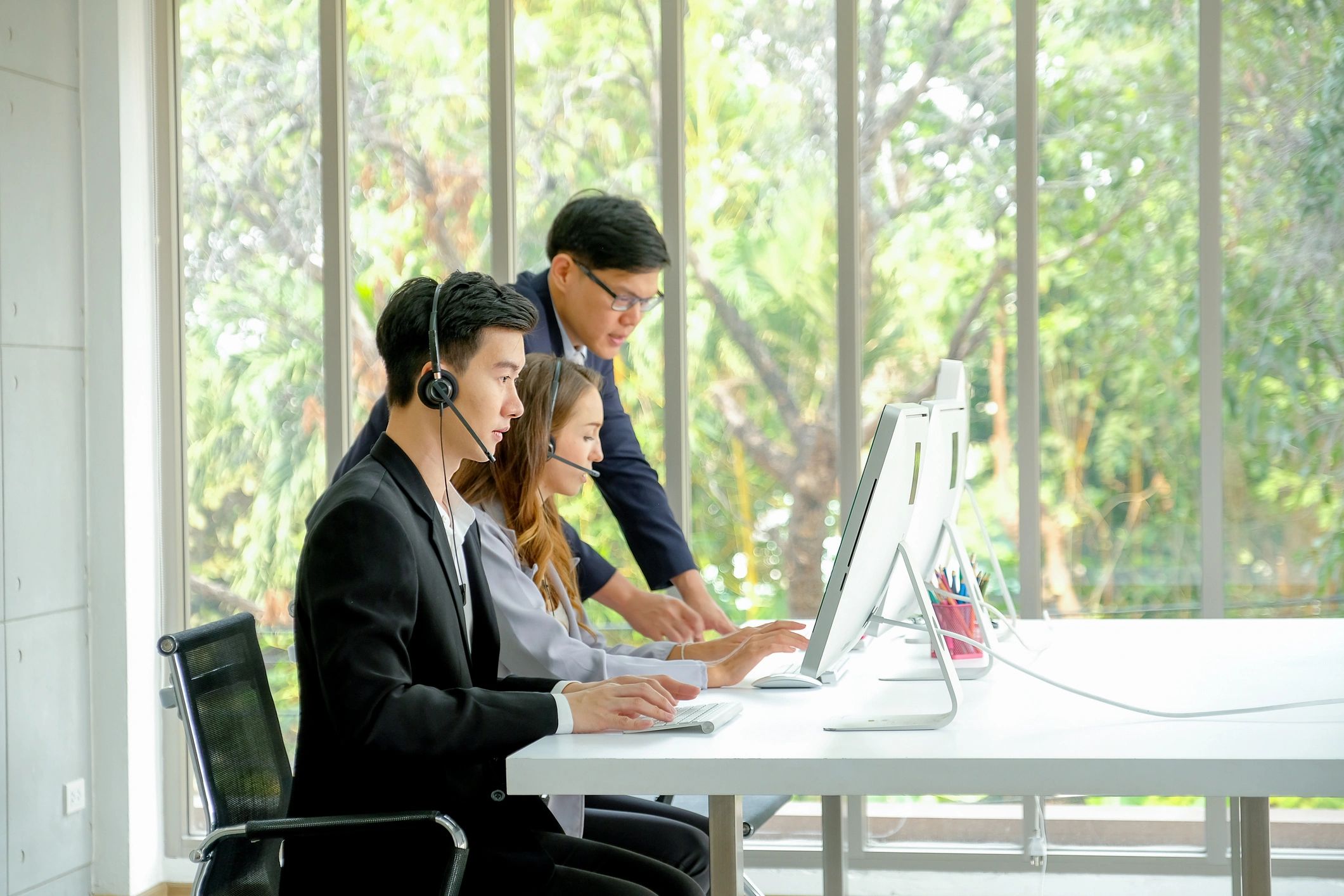 Technical support team assisting business customers