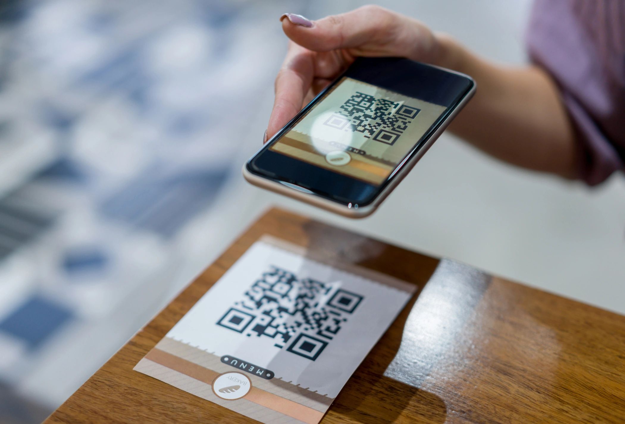 Restaurant guest scanning a code for menu access