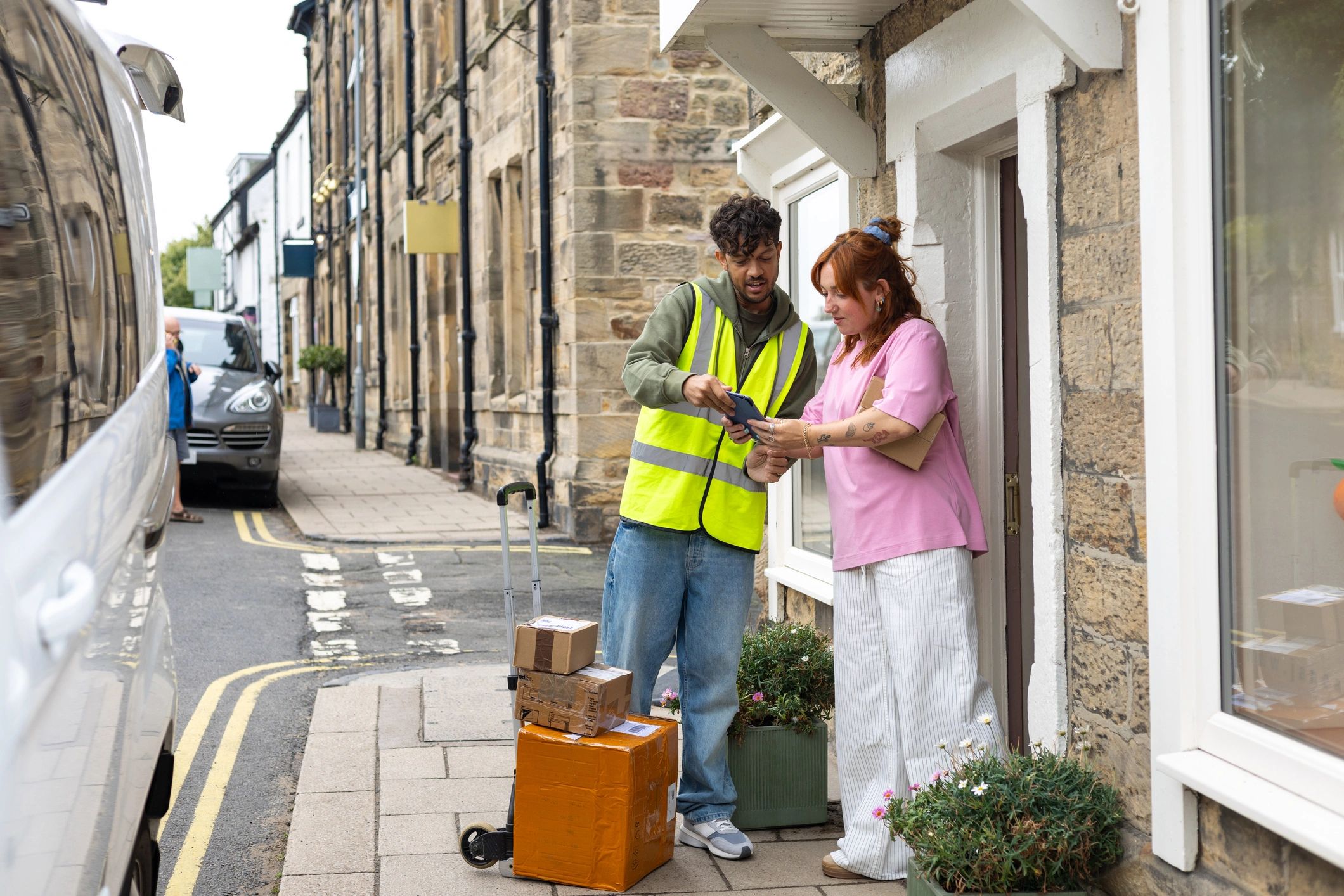 Delivery professional completing a business equipment shipment